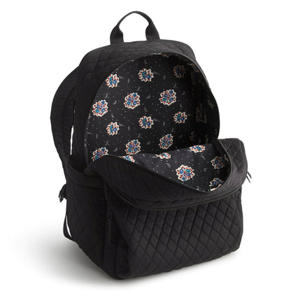 Black quilted backpack with floral pattern interior on a white background