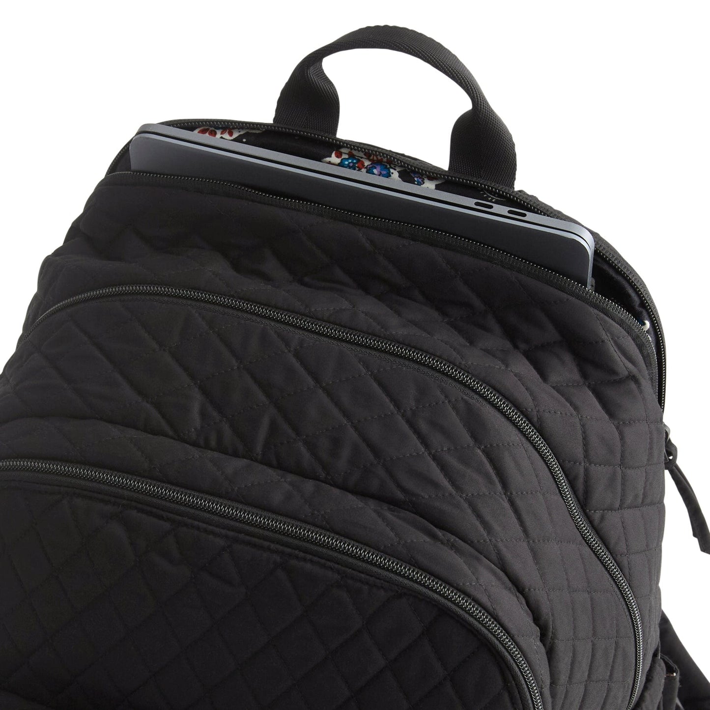 Black quilted backpack with a laptop compartment on a white background