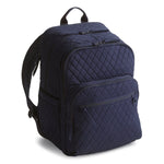 Navy blue quilted backpack on a white background