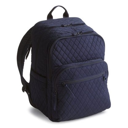 Navy blue quilted backpack on a white background