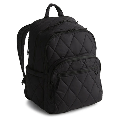 Black quilted backpack on a white background