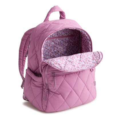 Purple quilted backpack with floral interior on a white background