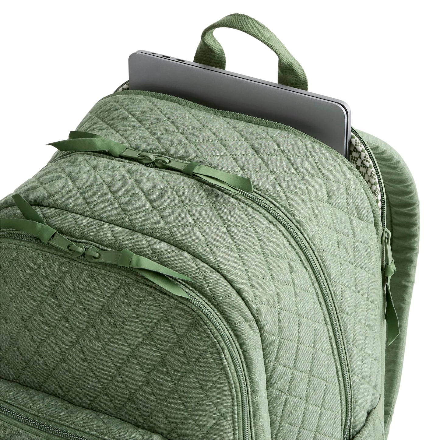 Green quilted backpack with a laptop compartment on a white background