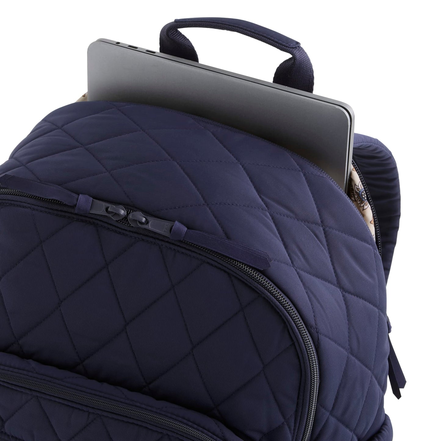 Navy blue quilted backpack with a laptop compartment on a white background
