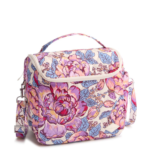 Floral patterned bag with a strap on a white background